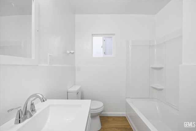 full bathroom featuring hardwood / wood-style flooring, shower / bath combination, sink, and toilet