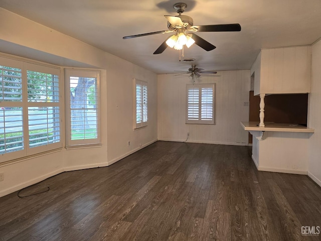 unfurnished living room featuring dark wood-type flooring