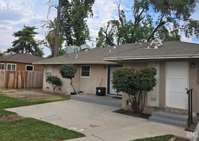 back of property with a patio area