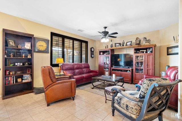 living room featuring ceiling fan and light tile patterned floors