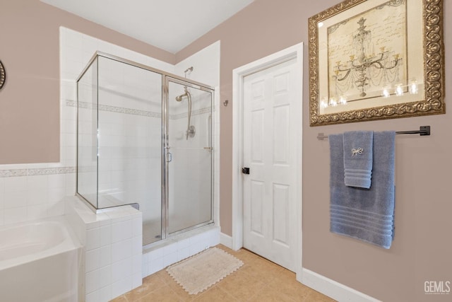 bathroom featuring separate shower and tub and tile patterned flooring