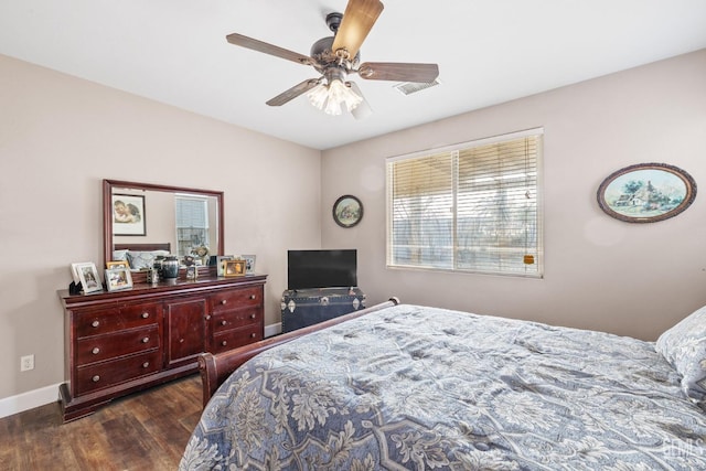 bedroom with dark wood-type flooring and ceiling fan