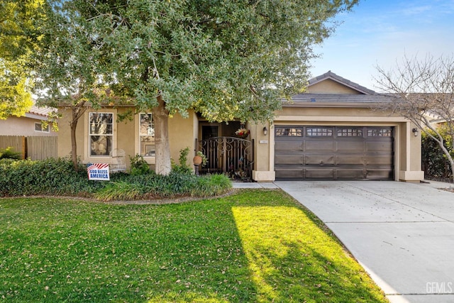 view of front of property with a garage and a front lawn