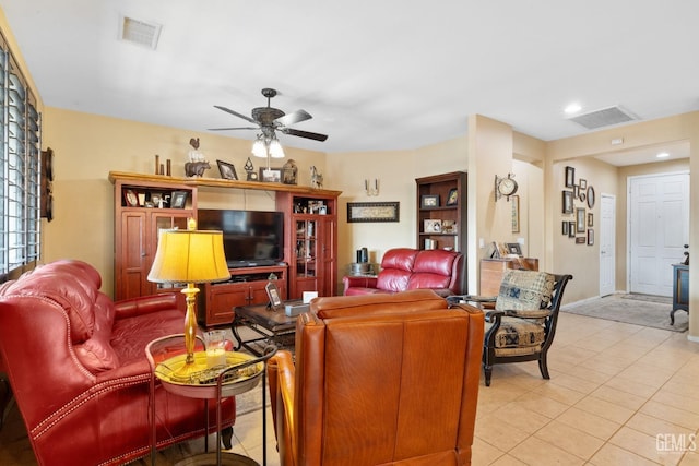 tiled living room with ceiling fan