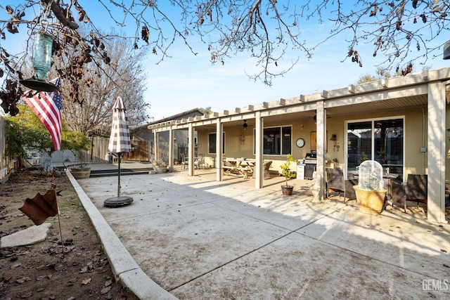 rear view of house with a patio