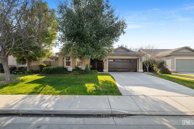 view of front of home featuring a garage and a front yard