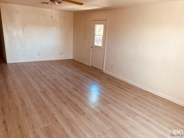 713 18th Pl, Delano, CA 93215 - spare room featuring ceiling fan, light wood finished floors, and a textured ceiling