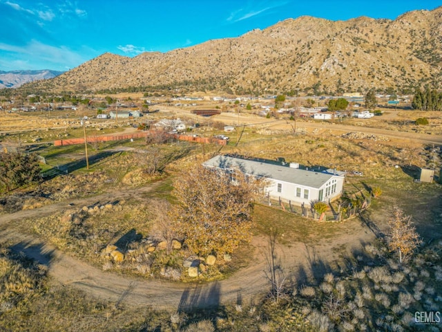 birds eye view of property with a mountain view and a rural view