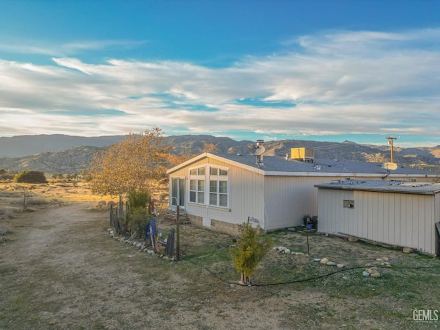 exterior space featuring a mountain view