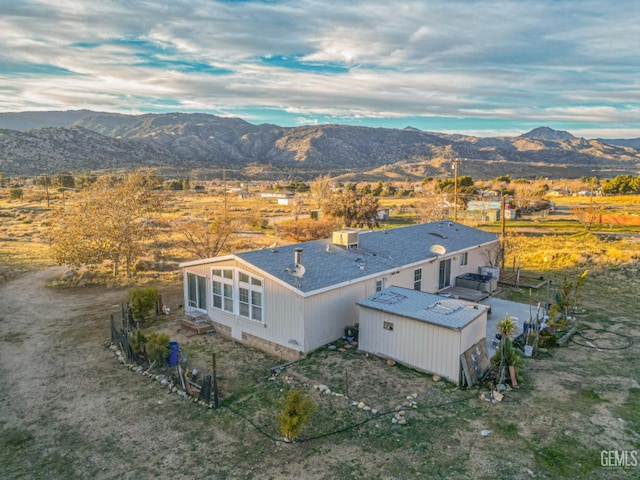 drone / aerial view featuring a mountain view