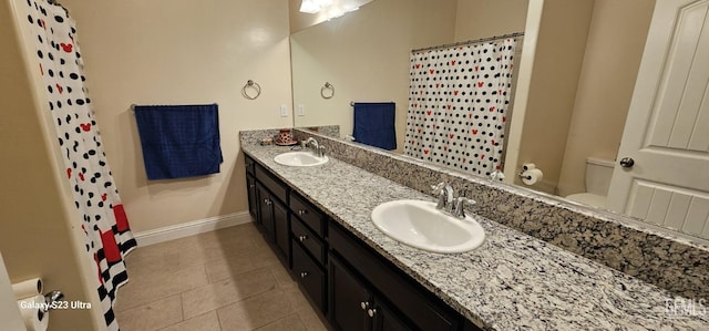 bathroom featuring vanity, tile patterned floors, toilet, and walk in shower