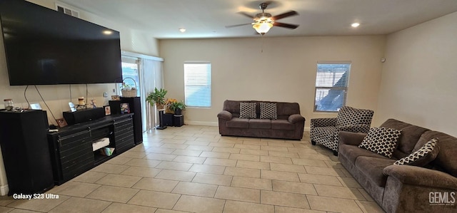 tiled living room with ceiling fan