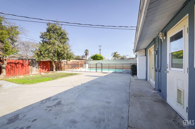 view of patio with a fenced in pool