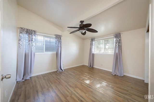 unfurnished room with vaulted ceiling, hardwood / wood-style floors, and ceiling fan