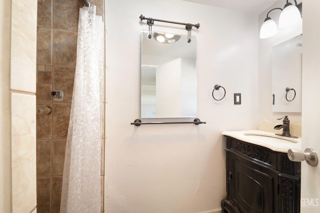 bathroom with vanity and curtained shower