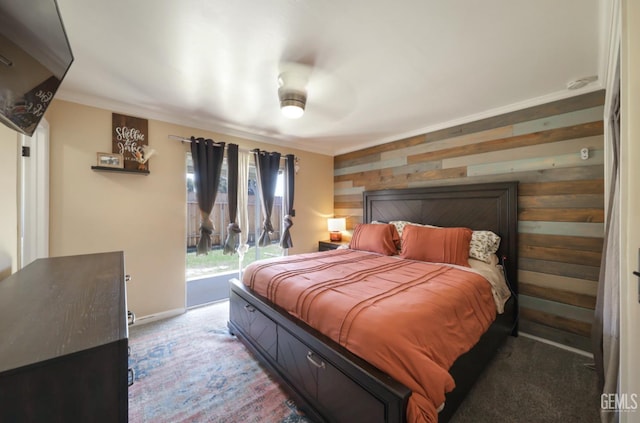 1107 Mcginley Ave, Bakersfield, CA 93308 - bedroom featuring carpet flooring, wooden walls, access to outside, baseboards, and a ceiling fan