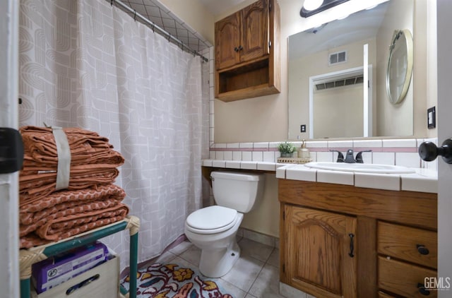 1107 Mcginley Ave, Bakersfield, CA 93308 - bathroom featuring toilet, vanity, tile patterned floors, and a shower with shower curtain
