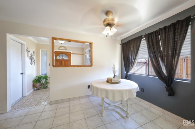 1107 Mcginley Ave, Bakersfield, CA 93308 - tiled dining space with a ceiling fan and crown molding