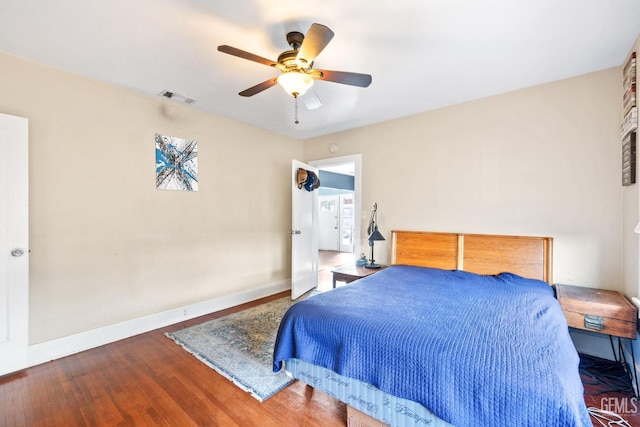 bedroom featuring hardwood / wood-style flooring and ceiling fan