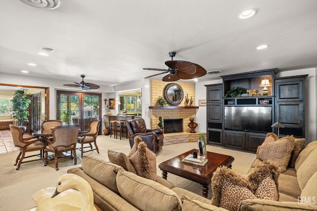 carpeted living room featuring a fireplace