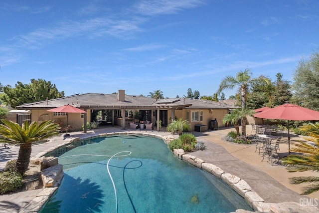 view of swimming pool with a patio area