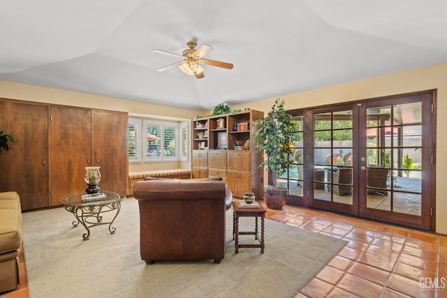 living room featuring french doors, vaulted ceiling, and ceiling fan