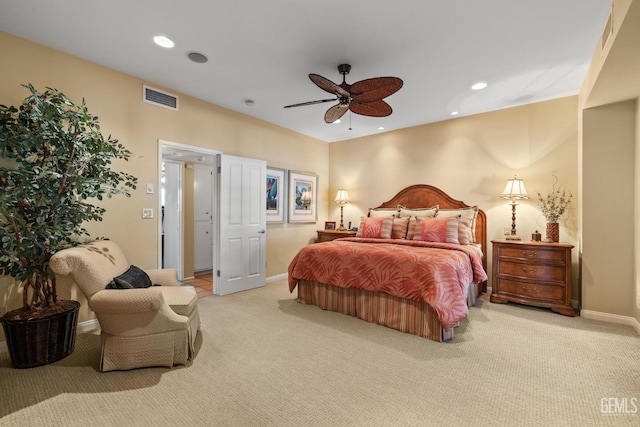 bedroom featuring light carpet and ceiling fan