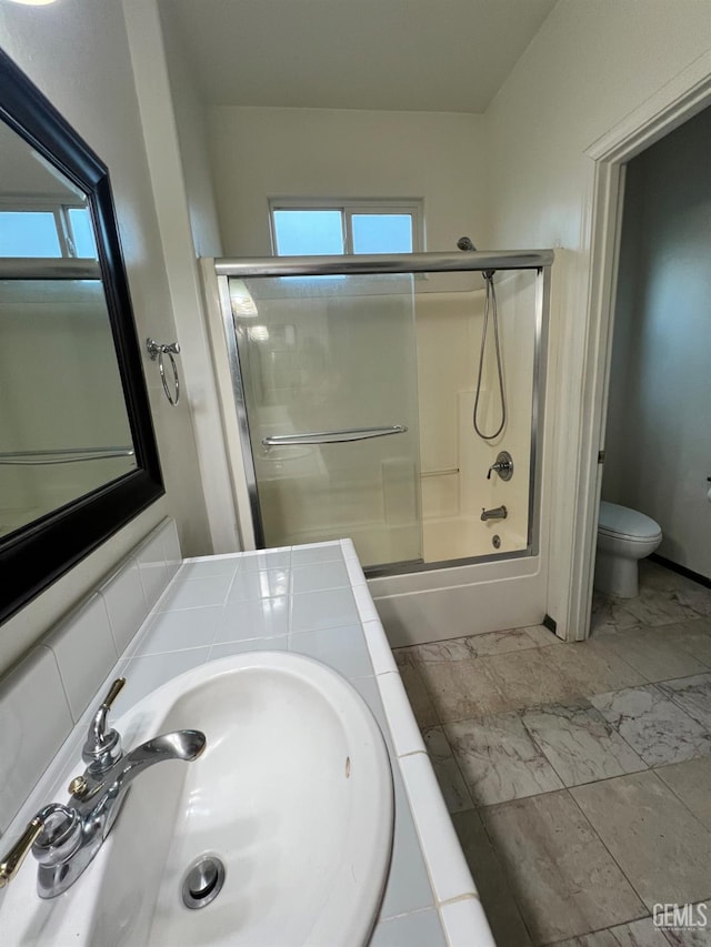 3205 Petite Sirah St, Bakersfield, CA 93306 - full bathroom featuring bath / shower combo with glass door, plenty of natural light, marble finish flooring, and vanity