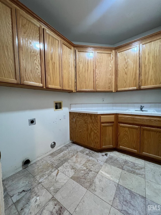 3205 Petite Sirah St, Bakersfield, CA 93306 - laundry area featuring cabinet space, hookup for a washing machine, hookup for an electric dryer, and light stone finish floors