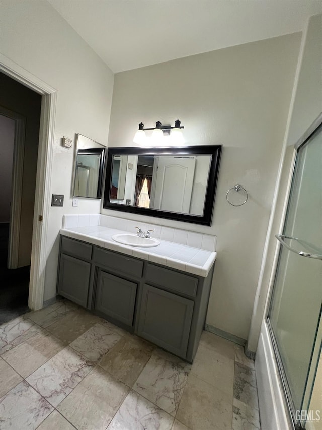 3205 Petite Sirah St, Bakersfield, CA 93306 - full bathroom featuring vanity, marble finish flooring, and shower / bath combination with glass door