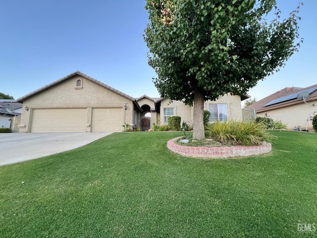 3205 Petite Sirah St, Bakersfield, CA 93306 - ranch-style home featuring stucco siding, a front lawn, a garage, and driveway