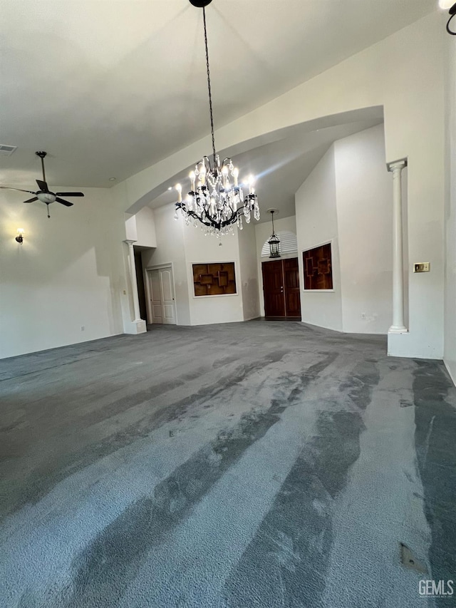 3205 Petite Sirah St, Bakersfield, CA 93306 - unfurnished living room featuring ceiling fan, carpet floors, a chandelier, and arched walkways