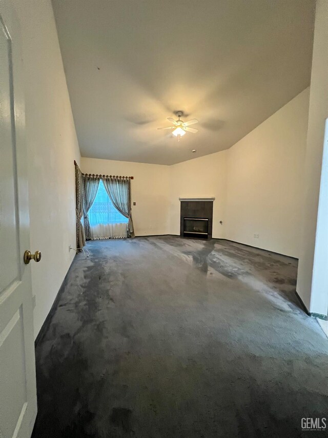 3205 Petite Sirah St, Bakersfield, CA 93306 - unfurnished living room with carpet flooring, lofted ceiling, ceiling fan, and a fireplace