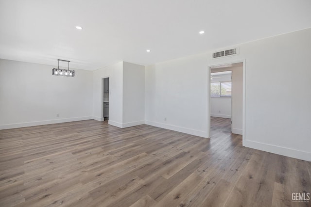 1813 6th Ave, Delano, CA 93215 - empty room with wood finished floors, baseboards, and recessed lighting