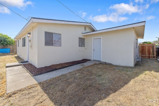 1813 6th Ave, Delano, CA 93215 - rear view of house with stucco siding