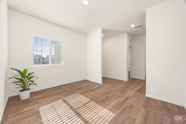 7305 Scrivia Ct, Bakersfield, CA 93311 - spare room with wood finished floors, recessed lighting, and baseboards