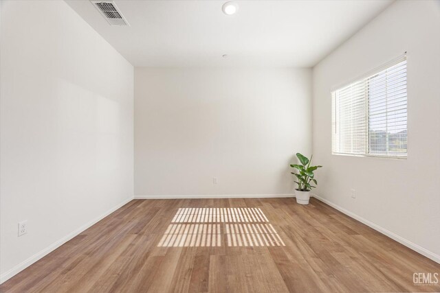7305 Scrivia Ct, Bakersfield, CA 93311 - empty room with wood finished floors and baseboards