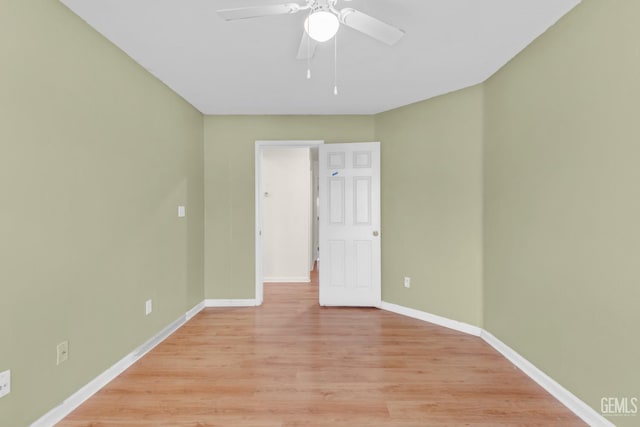 unfurnished room with ceiling fan and light wood-type flooring