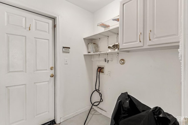 laundry area with cabinets and hookup for a washing machine