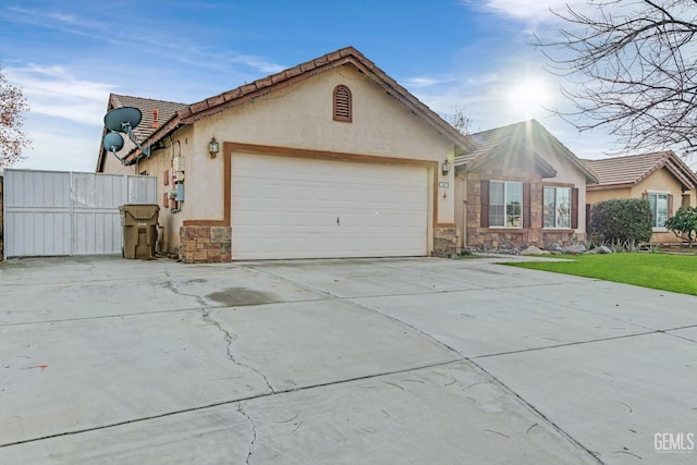 ranch-style home featuring a garage