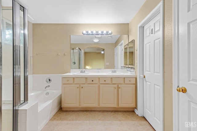 bathroom featuring tile patterned floors, vanity, and plus walk in shower