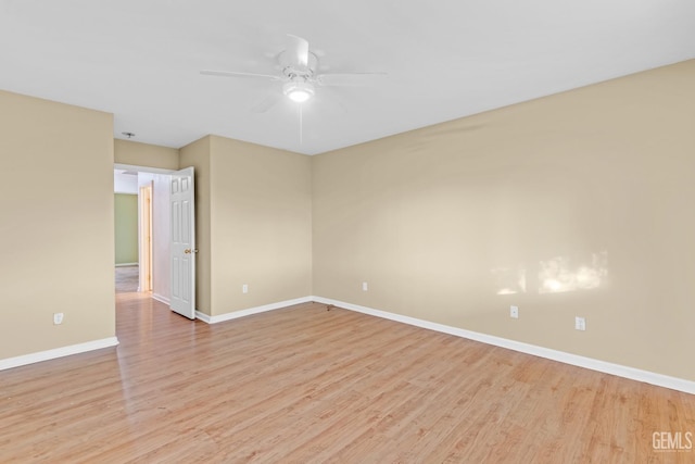 spare room with ceiling fan and light hardwood / wood-style flooring