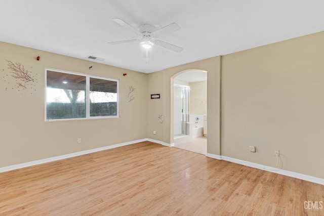 spare room featuring ceiling fan and light hardwood / wood-style floors