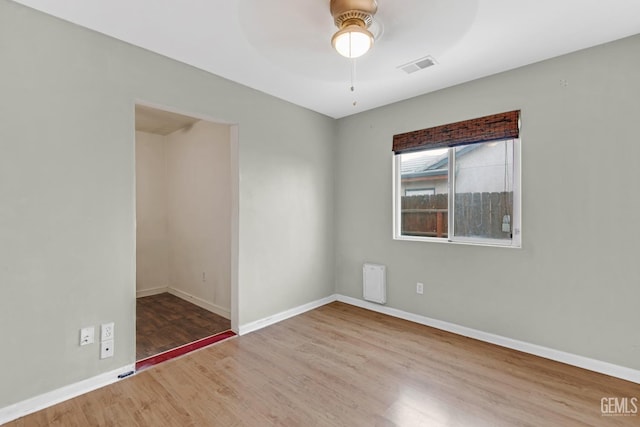 unfurnished room featuring ceiling fan and wood-type flooring