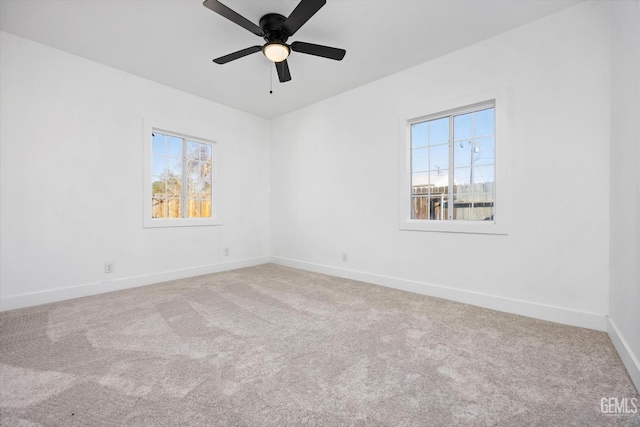 empty room featuring ceiling fan and carpet floors