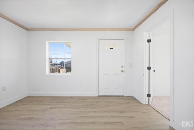 entrance foyer with light wood-type flooring and crown molding