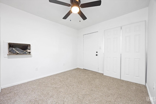 unfurnished bedroom with carpet floors and ceiling fan