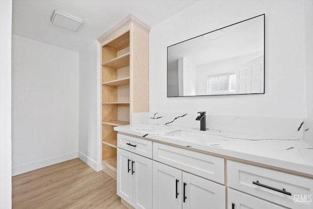 bathroom with vanity and hardwood / wood-style flooring