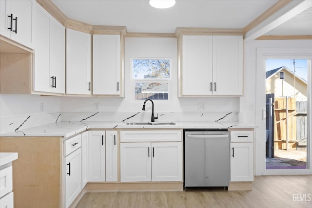 kitchen with light stone counters, stainless steel dishwasher, crown molding, and sink