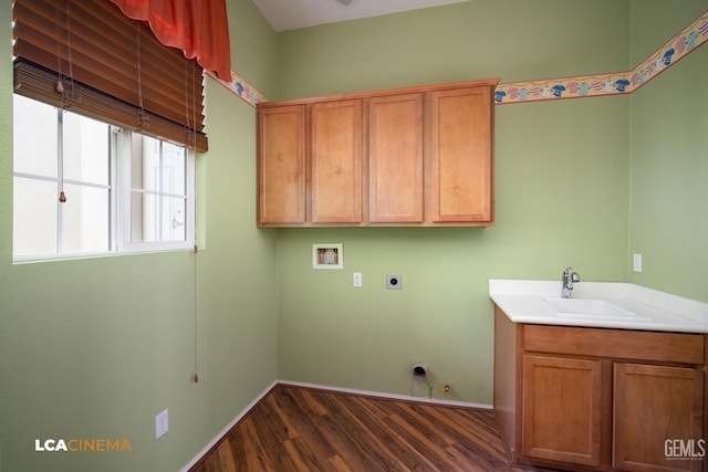 laundry room with washer hookup, a sink, dark wood finished floors, cabinet space, and hookup for an electric dryer